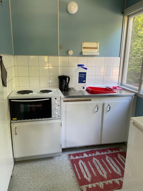 Kuchyň nebo kuchyňský kout v ubytování Ormanäsgårdens Stugby