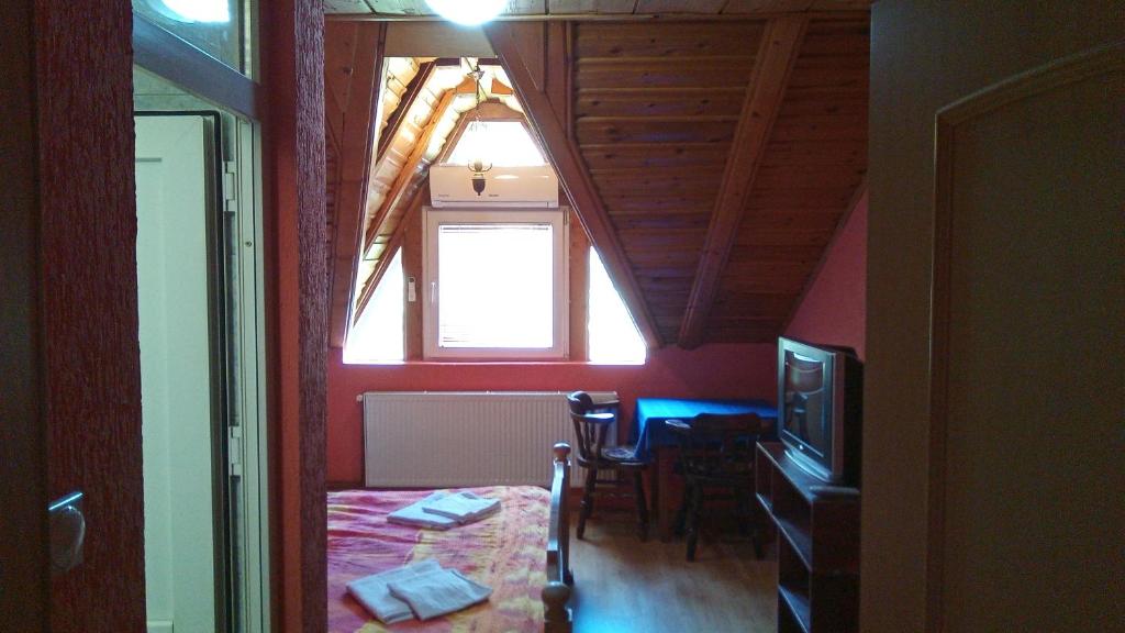 Postel nebo postele na pokoji v ubytování Motel Lovac