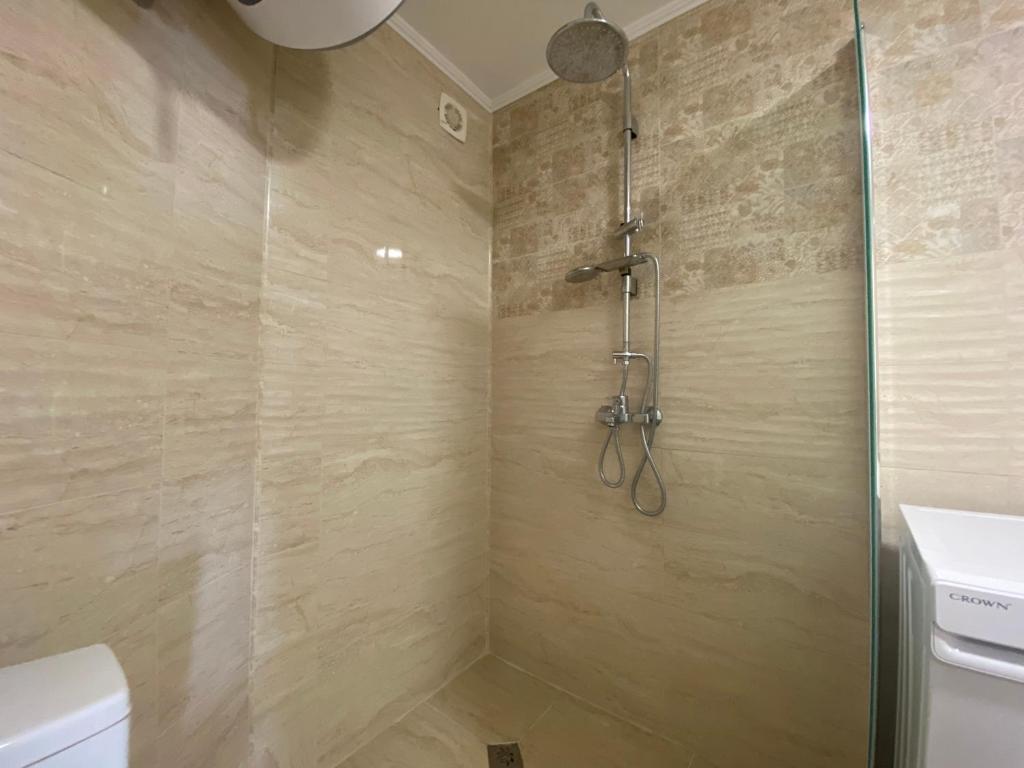 a bathroom with a shower with a toilet and a sink at MARINA BAY 23 Sveti Vlas Beach in Sveti Vlas