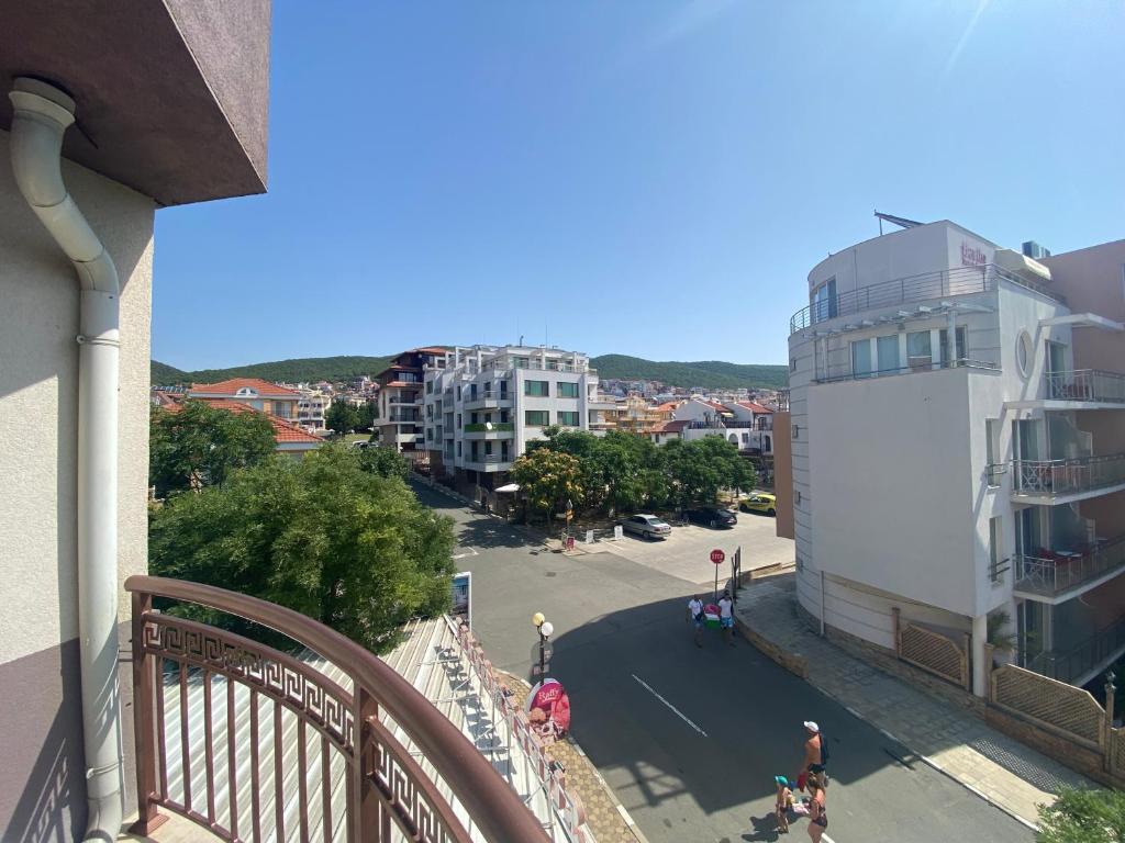 a view of a street from a balcony of a building at MARINA BAY 23 Sveti Vlas Beach in Sveti Vlas