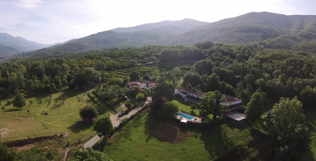 an aerial view of a house in the mountains at La Casería in Navaconcejo