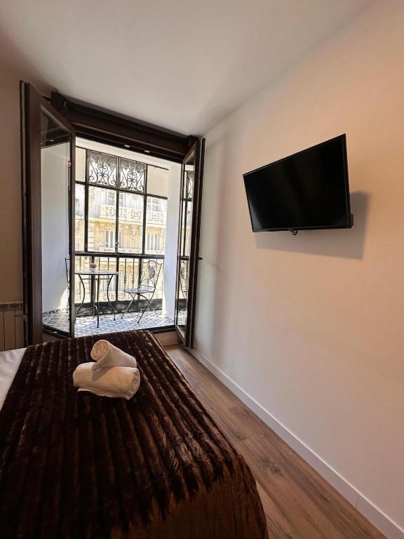 TV a/nebo společenská místnost v ubytování Hostal Arenal Madrid