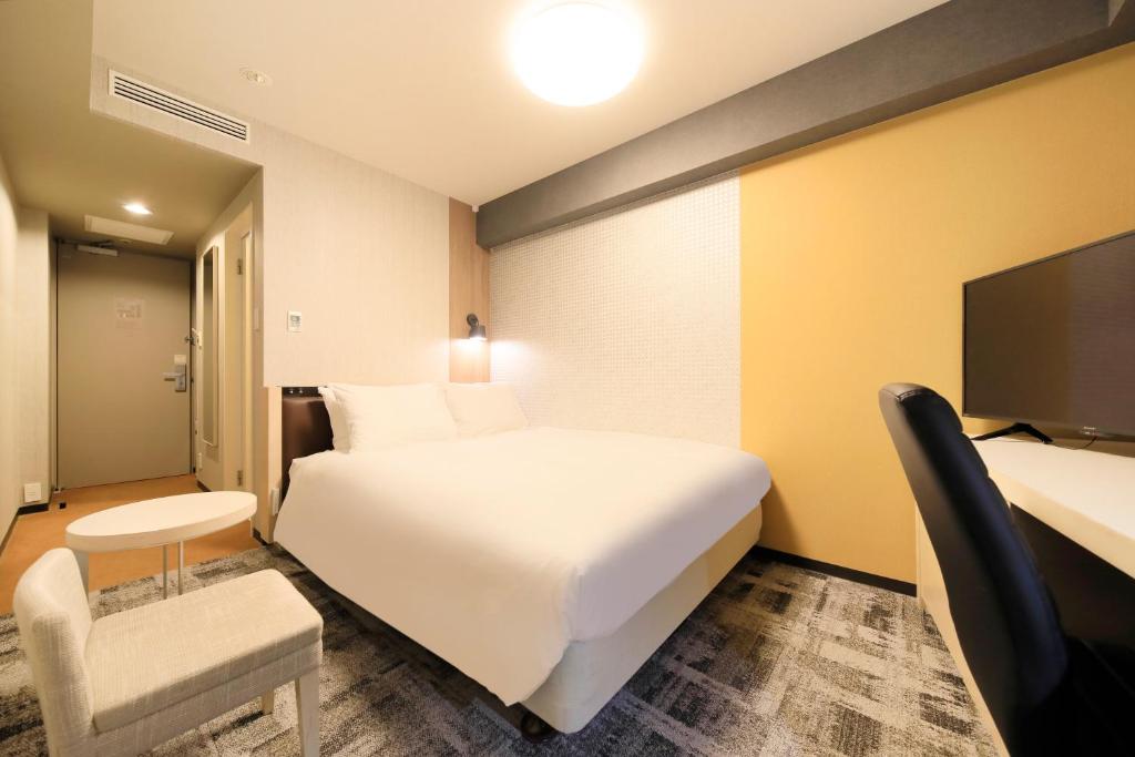 Postel nebo postele na pokoji v ubytování Richmond Hotel Narita