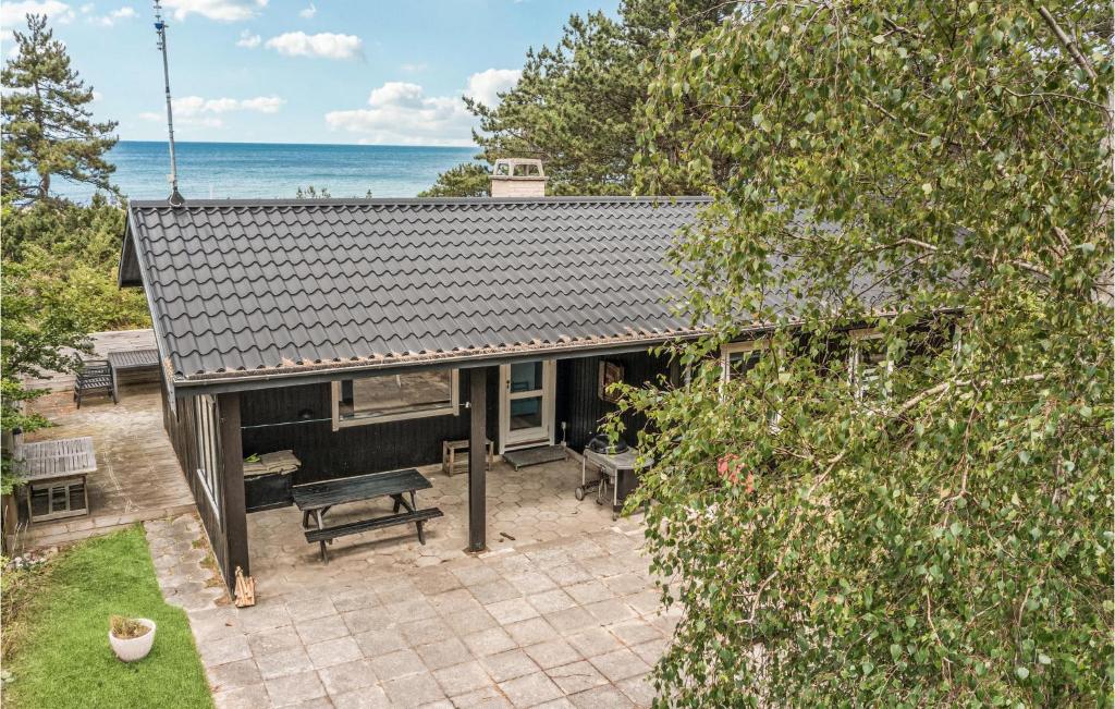 an overhead view of a house with the ocean in the background at Nice Home In Sjllands Odde With House Sea View in Tjørneholm