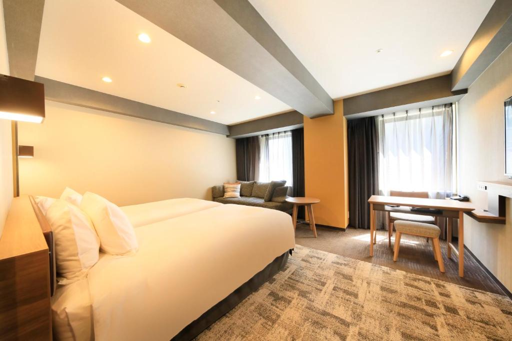 Postel nebo postele na pokoji v ubytování Richmond Hotel Narita