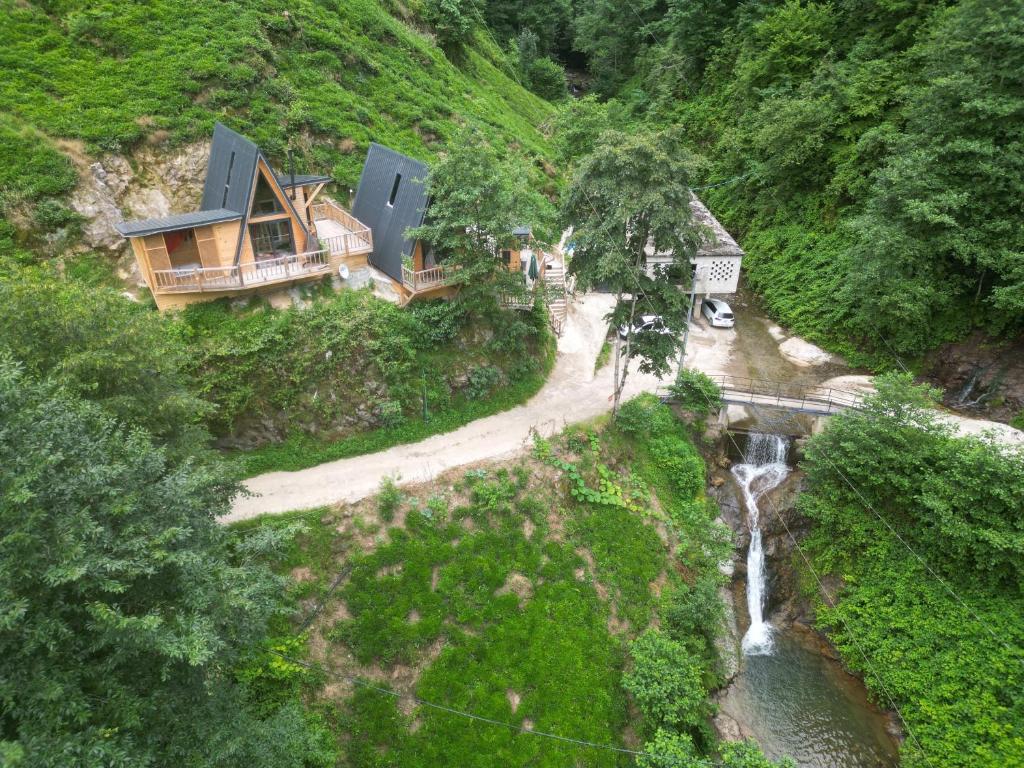 an aerial view of a house on a hill with a waterfall at AsvaVilla şelale evleri in Rize