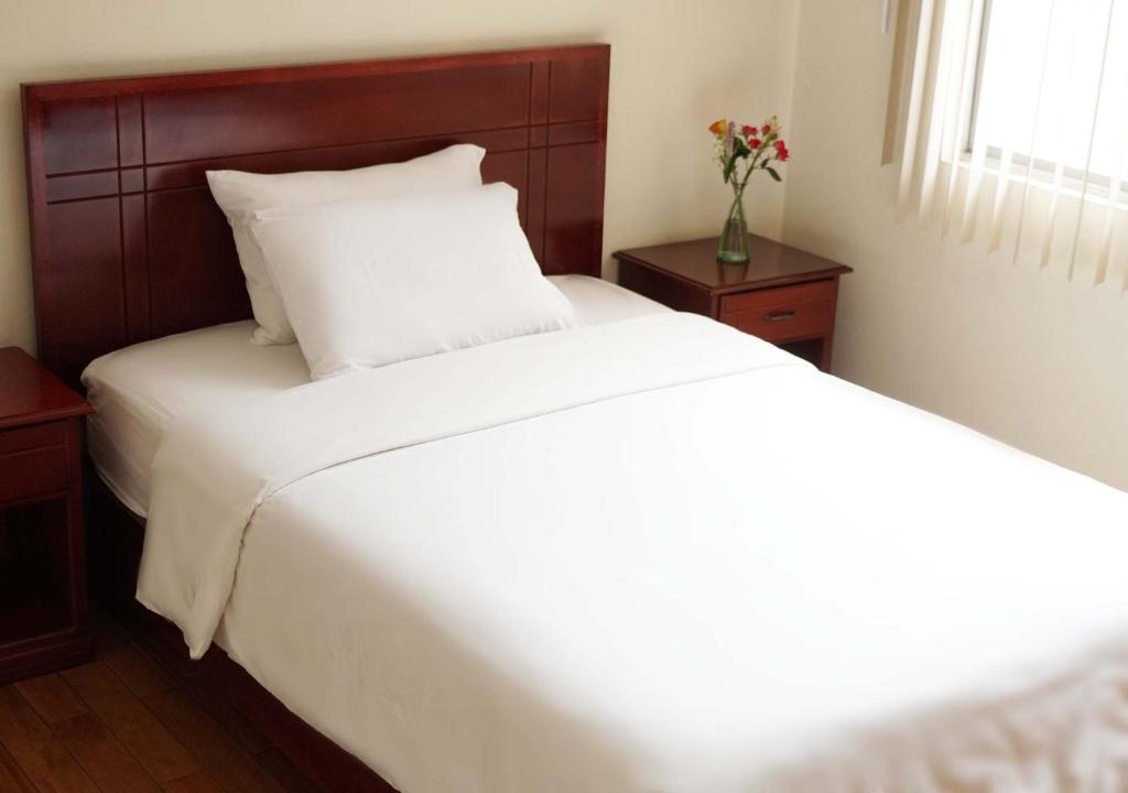 Postel nebo postele na pokoji v ubytování Hotel Lottus