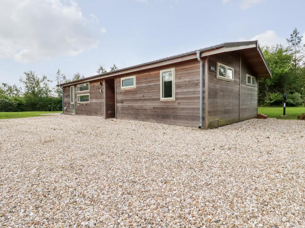 a house on a gravel lot with a garage at 14 Horizon View in Liskeard