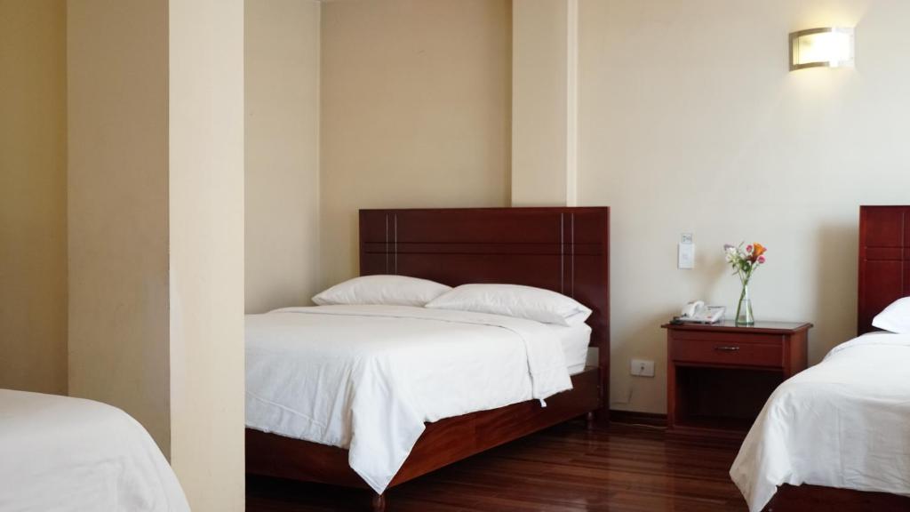 Postel nebo postele na pokoji v ubytování Hotel Lottus