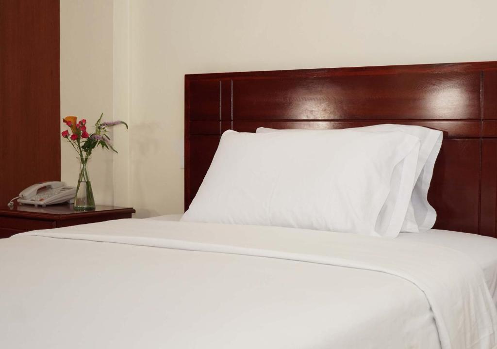Postel nebo postele na pokoji v ubytování Hotel Lottus