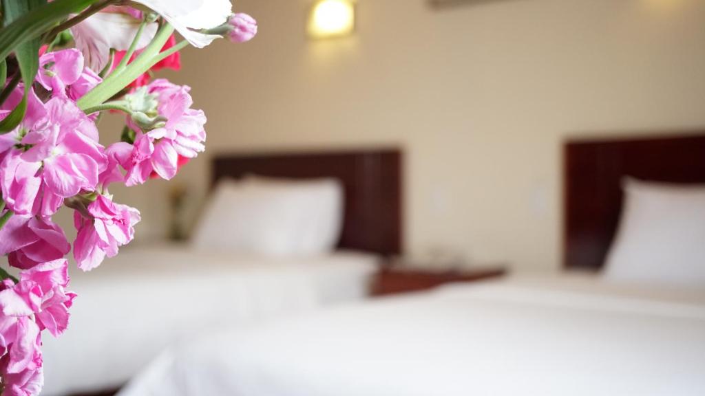 Postel nebo postele na pokoji v ubytování Hotel Lottus