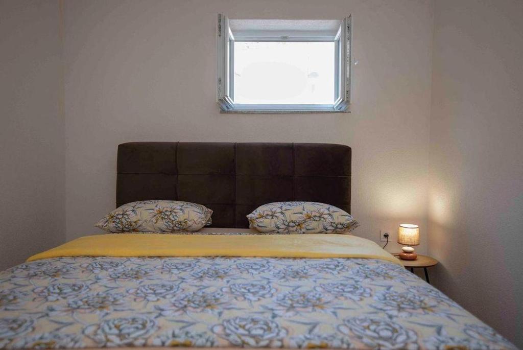 Postelja oz. postelje v sobi nastanitve Apartmani Berdovic