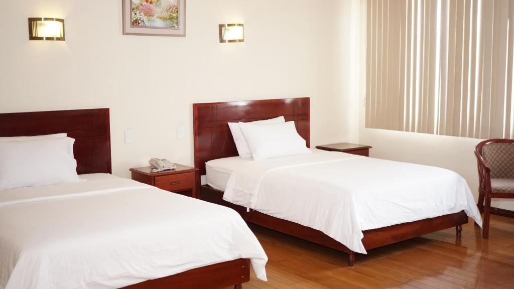 Postel nebo postele na pokoji v ubytování Hotel Lottus