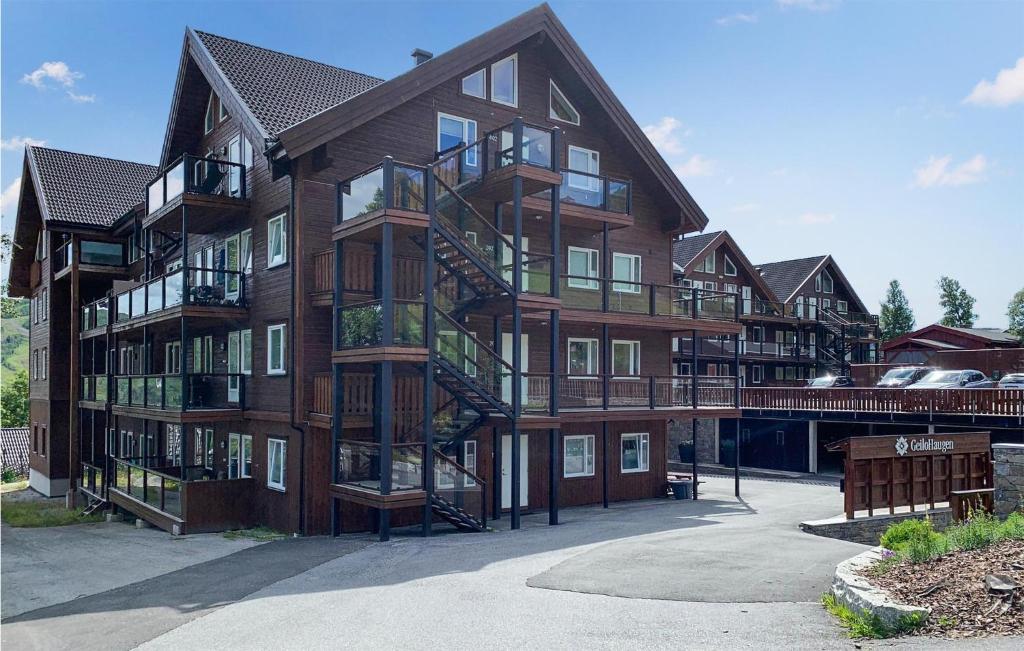 a large apartment building with a fire escape at Lovely Apartment In Geilo With Wifi in Geilo