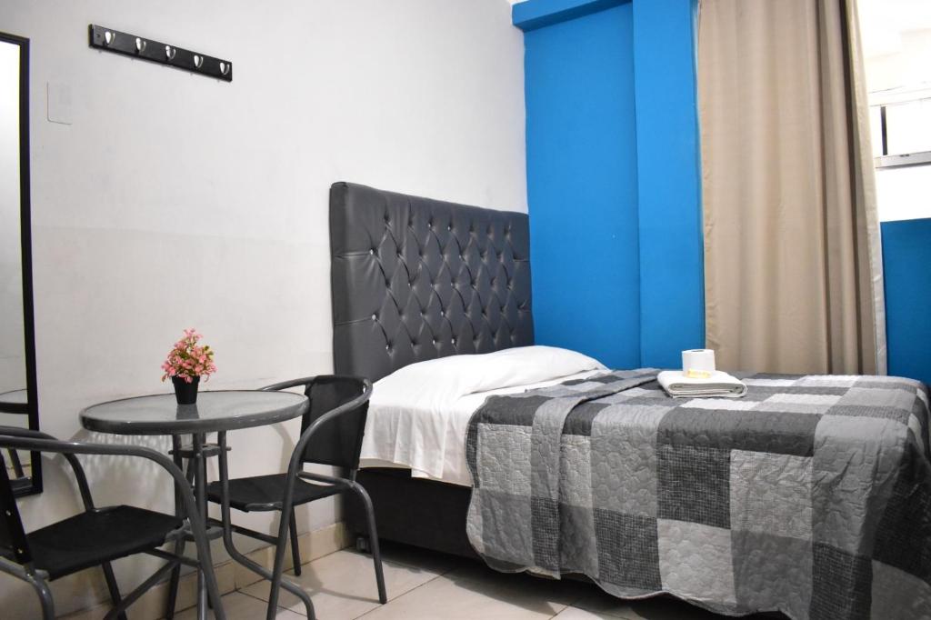 Postel nebo postele na pokoji v ubytování AYPA Hostal