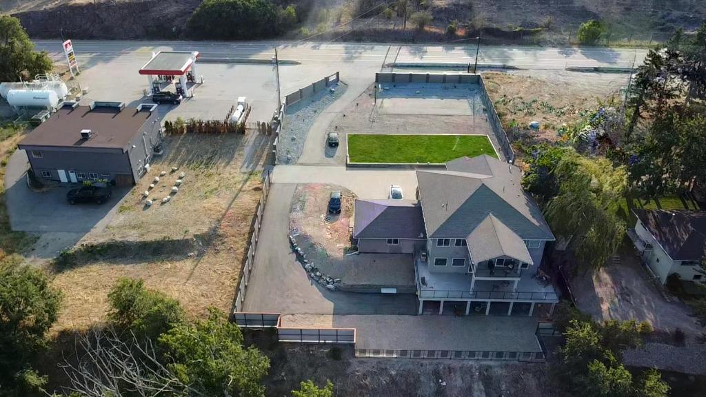 an aerial view of a large house with a yard at Kaleden Guest Suite in Okanagan Falls