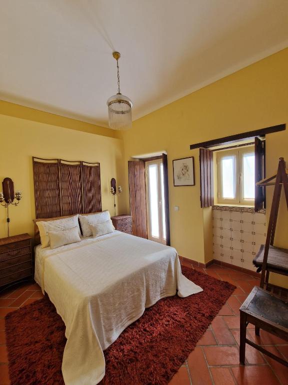 Postel nebo postele na pokoji v ubytování Casa do Avô Lopes