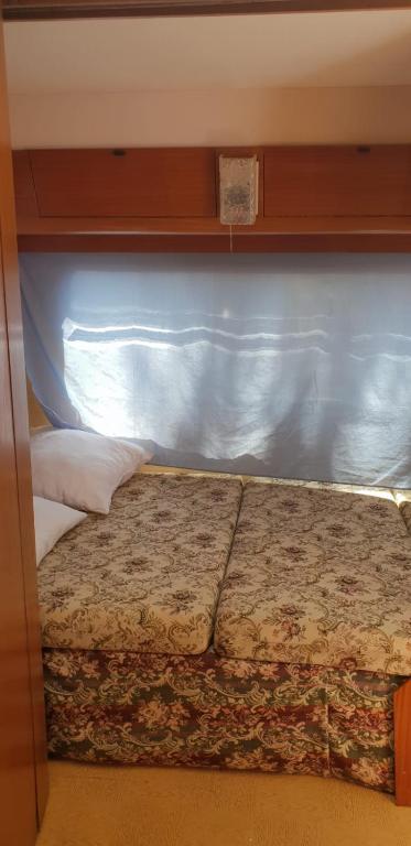 Postel nebo postele na pokoji v ubytování coté plage caravane front de mer