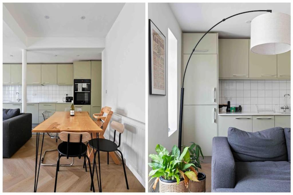 a kitchen and a living room with a table and a couch at Modern 3 Bed Apartment in Tottenham in London