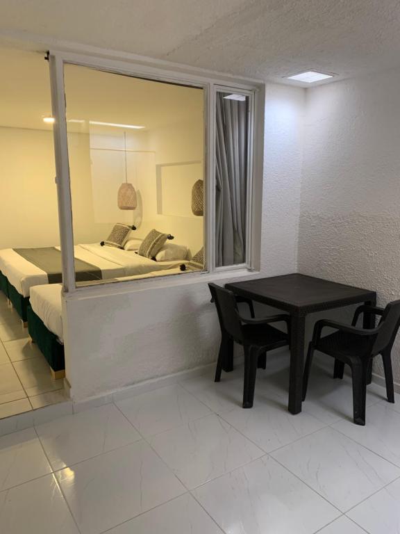Postel nebo postele na pokoji v ubytování Hotel Quintas de Normandia
