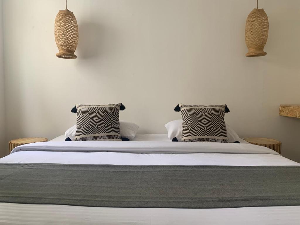 Postel nebo postele na pokoji v ubytování Hotel Quintas de Normandia