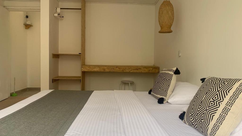 Postel nebo postele na pokoji v ubytování Hotel Quintas de Normandia
