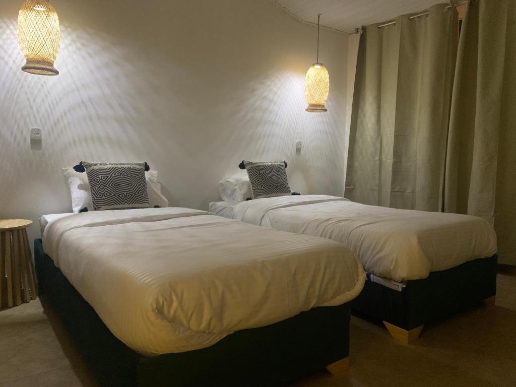 Postel nebo postele na pokoji v ubytování Hotel Quintas de Normandia