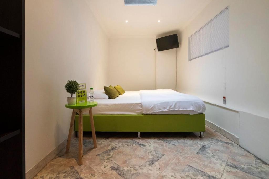 Postel nebo postele na pokoji v ubytování Hotel Quintas de Normandia