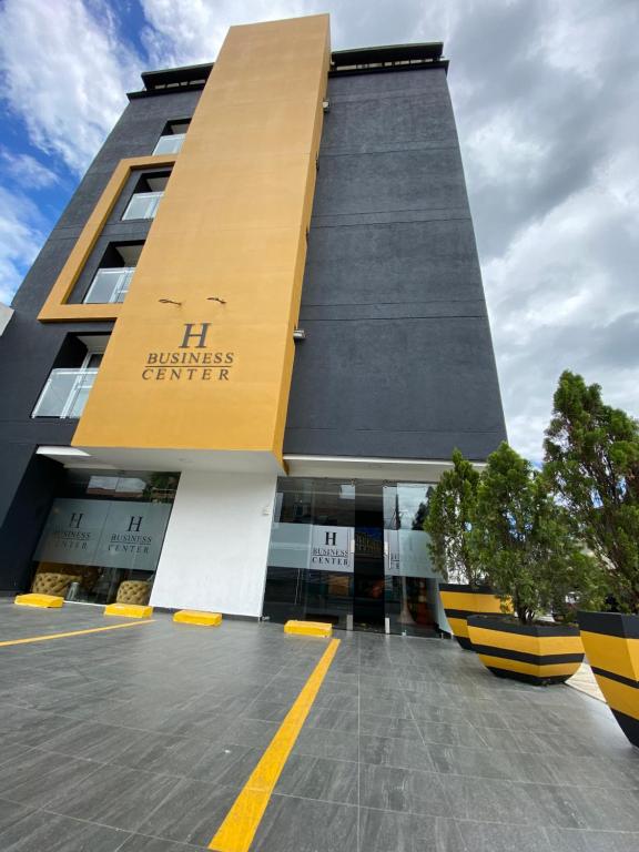 a building with a yellow and black at Hotel Business Center in Popayan