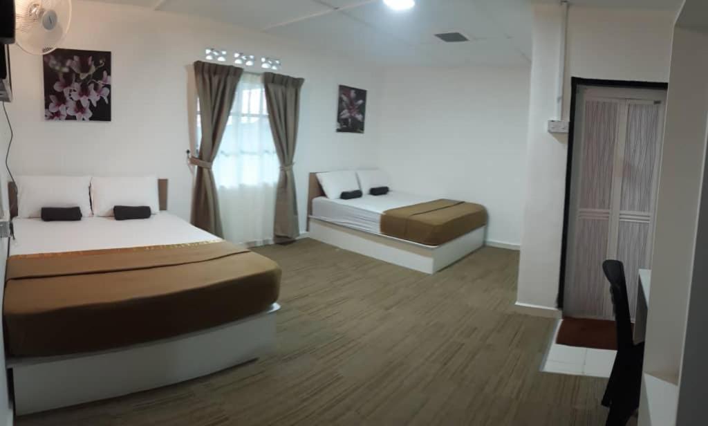 Voodi või voodid majutusasutuse Darulmakmur Chalet toas