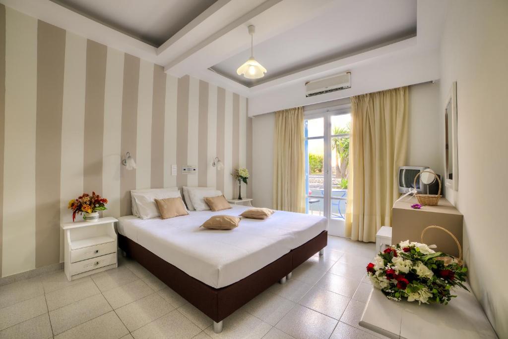 Postel nebo postele na pokoji v ubytování Pantheon Hotel