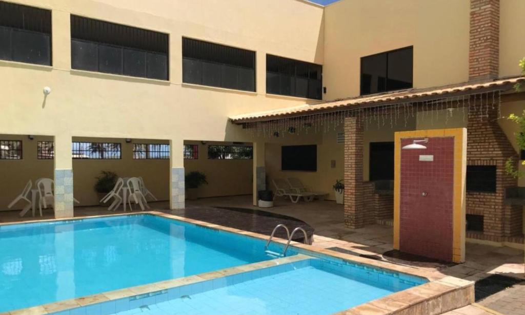 Apartamento Porto das Dunas tesisinde veya buraya yakın yüzme havuzu