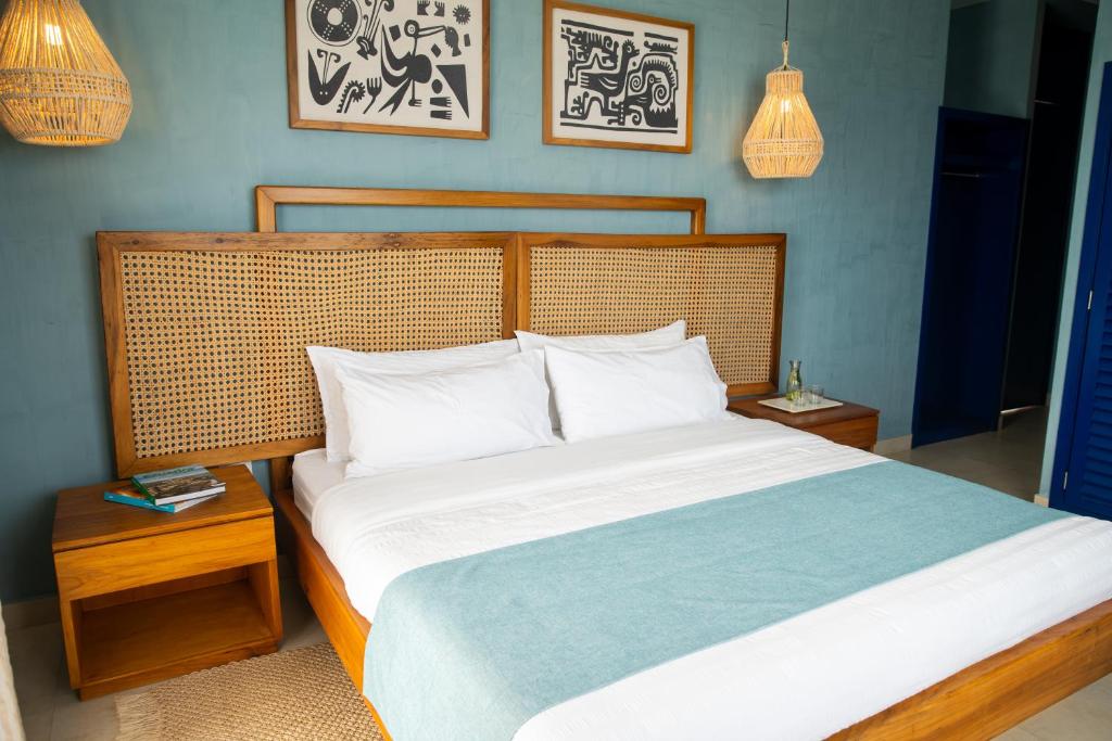 Postel nebo postele na pokoji v ubytování Jama Campay - Homes Resort & Spa