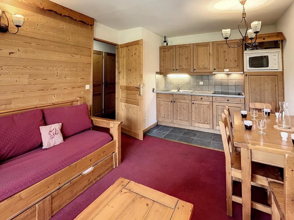 a living room with a couch and a table at Appartement La Toussuire, 2 pièces, 4 personnes - FR-1-267-271 in La Toussuire