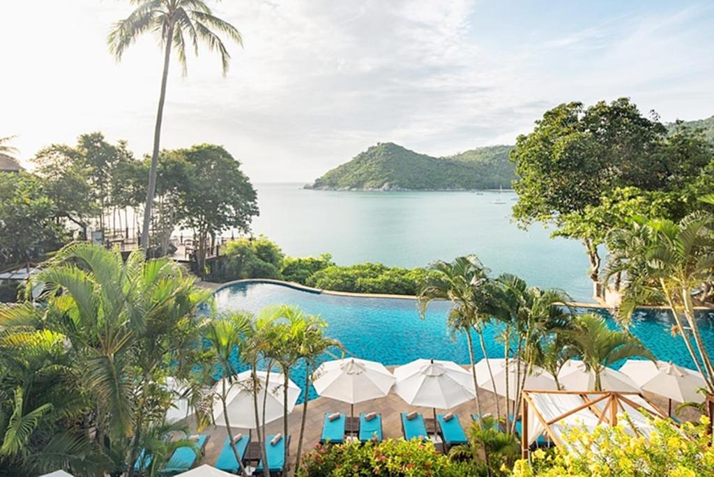 a view of the ocean from a resort pool at Panviman Resort Koh Phangan - SHA Extra Plus in Thong Nai Pan Noi