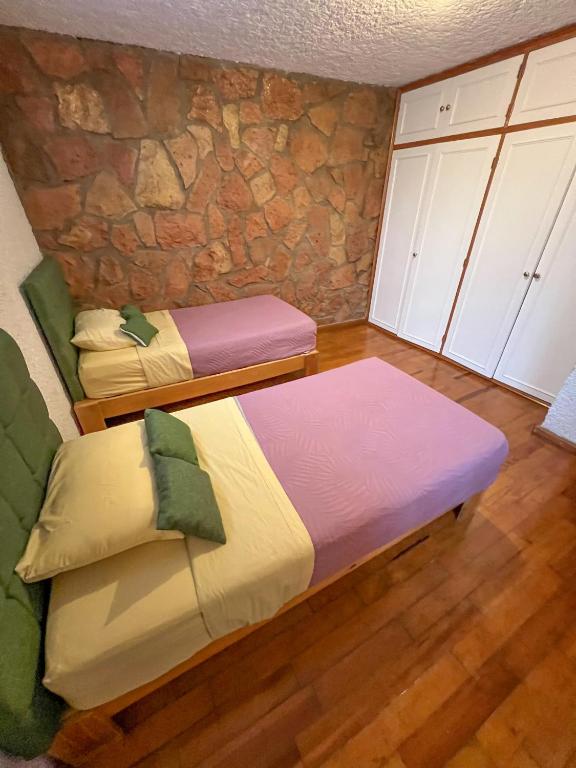 Postel nebo postele na pokoji v ubytování Hotel RJ Querétaro