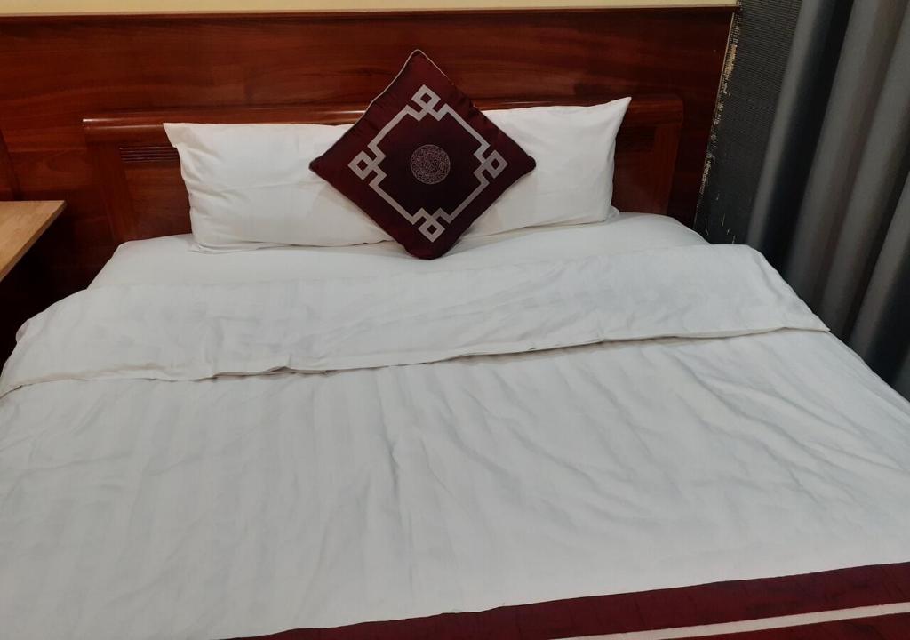 Postel nebo postele na pokoji v ubytování simple 14 nha chung