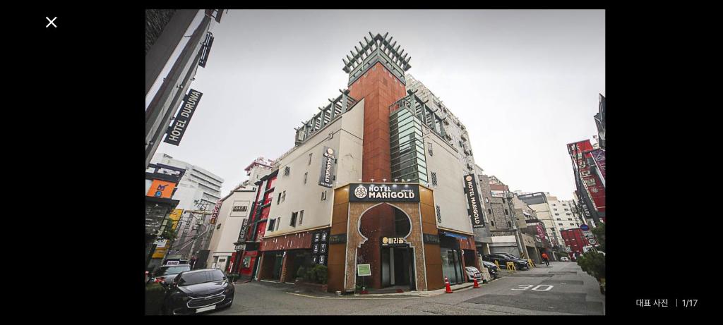 a building on the corner of a city street at Hotel Marigold in Incheon