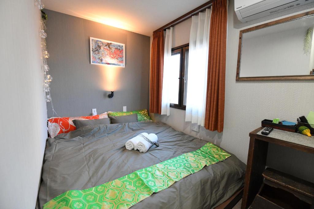 Postel nebo postele na pokoji v ubytování Hotel Tokyo Hub