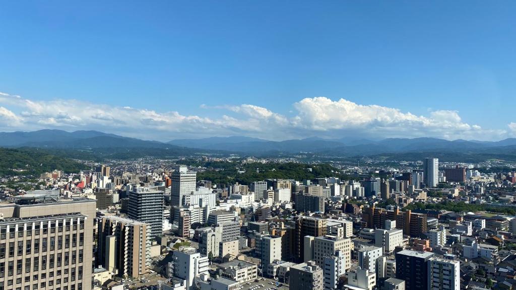 an aerial view of a city with tall buildings at Hotel Nikko Kanazawa in Kanazawa