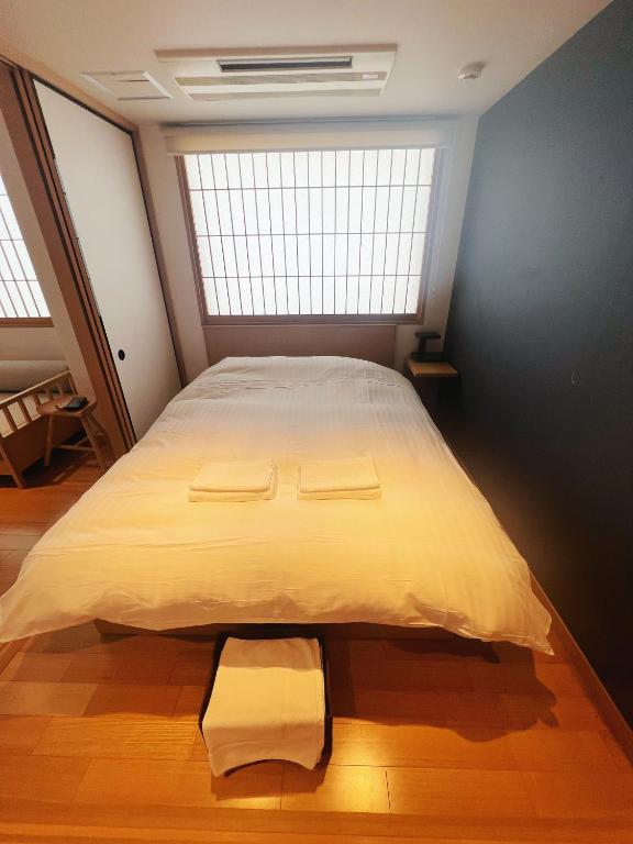 Postel nebo postele na pokoji v ubytování Nplus Tokyo Akihabara Premium