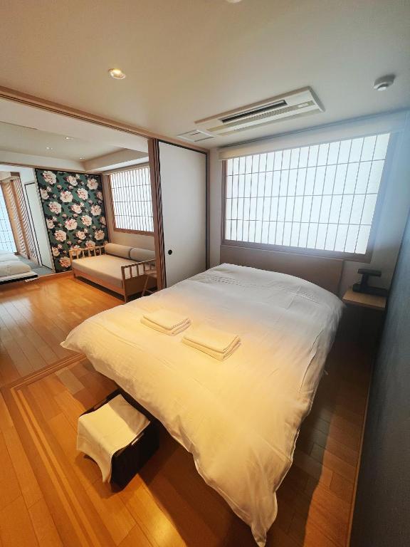 Postel nebo postele na pokoji v ubytování Nplus Tokyo Akihabara Premium