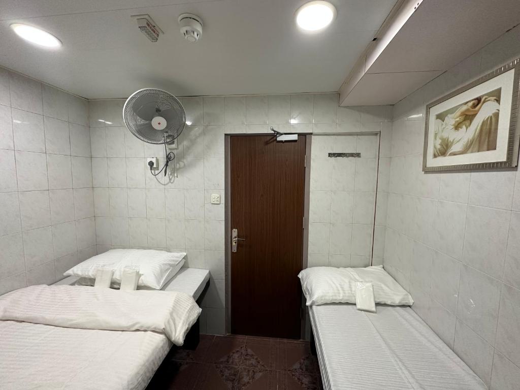Mandarin Guest House 객실 침대