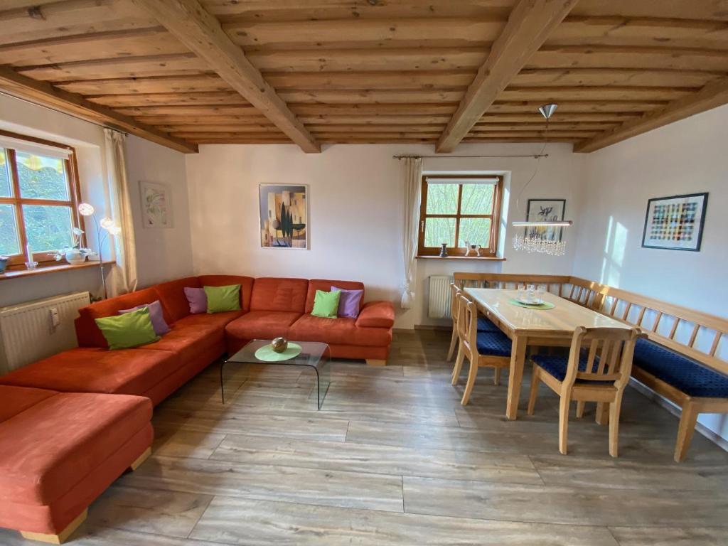 a living room with a couch and a table at Ferienwohnung Waldesruhe 303 Hauzenberg in Hauzenberg
