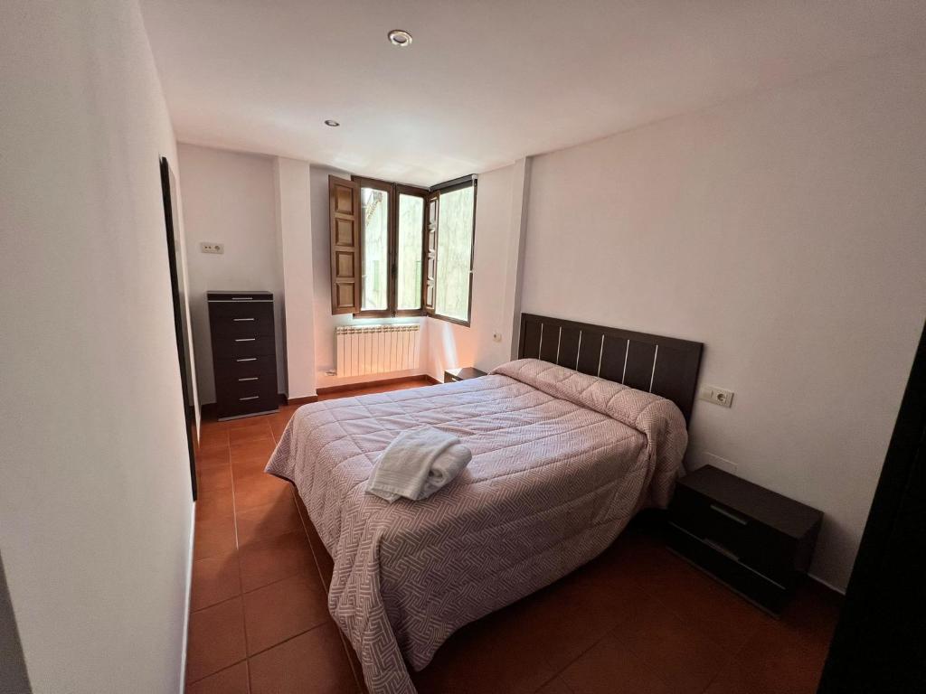Postel nebo postele na pokoji v ubytování Apartamentos Raíces
