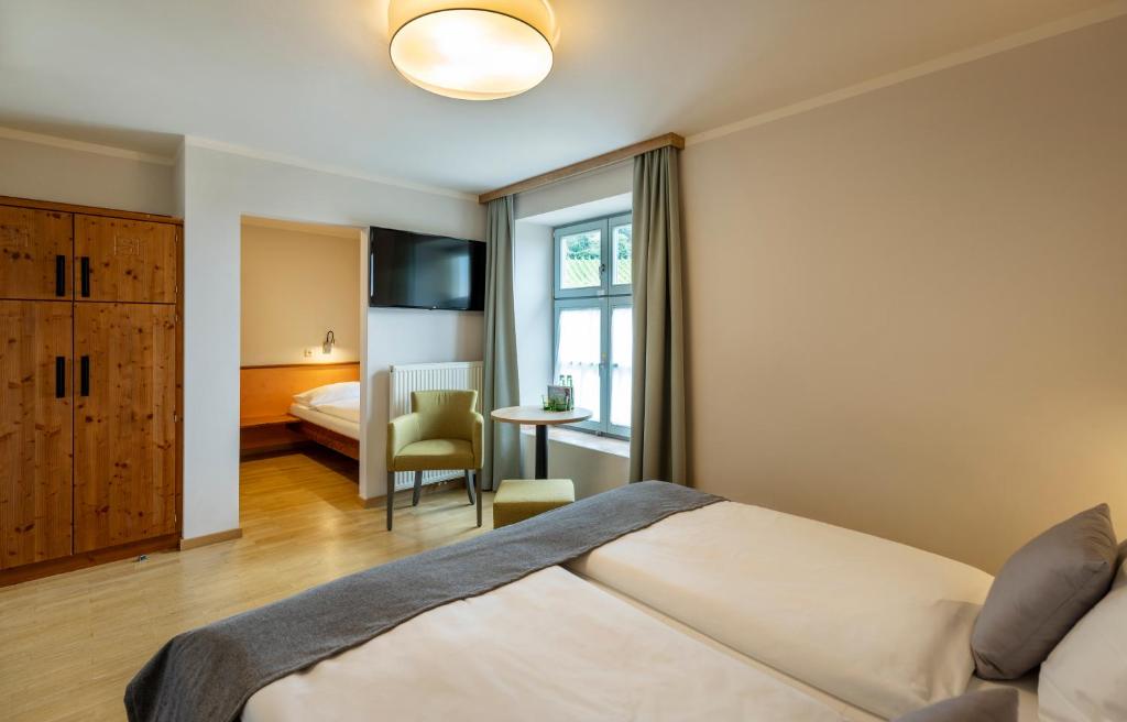 Postel nebo postele na pokoji v ubytování JUFA Hotel Deutschlandsberg