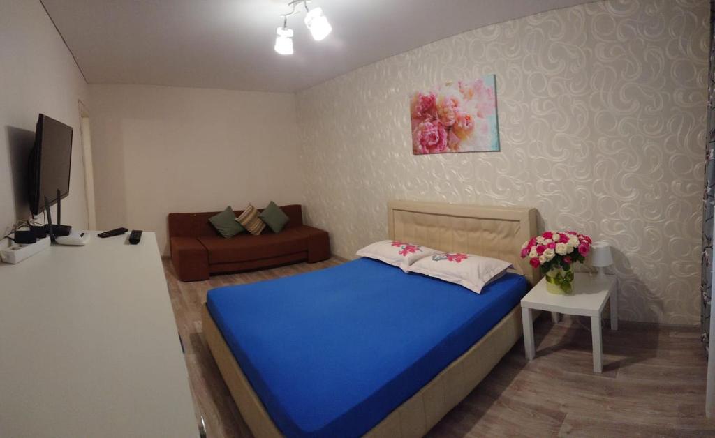 מיטה או מיטות בחדר ב-Квартира у метро Спортивная