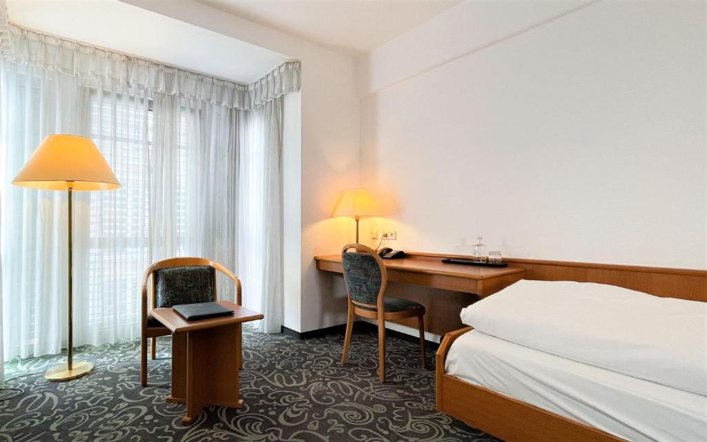 Postel nebo postele na pokoji v ubytování ALFA Hotel - Superior