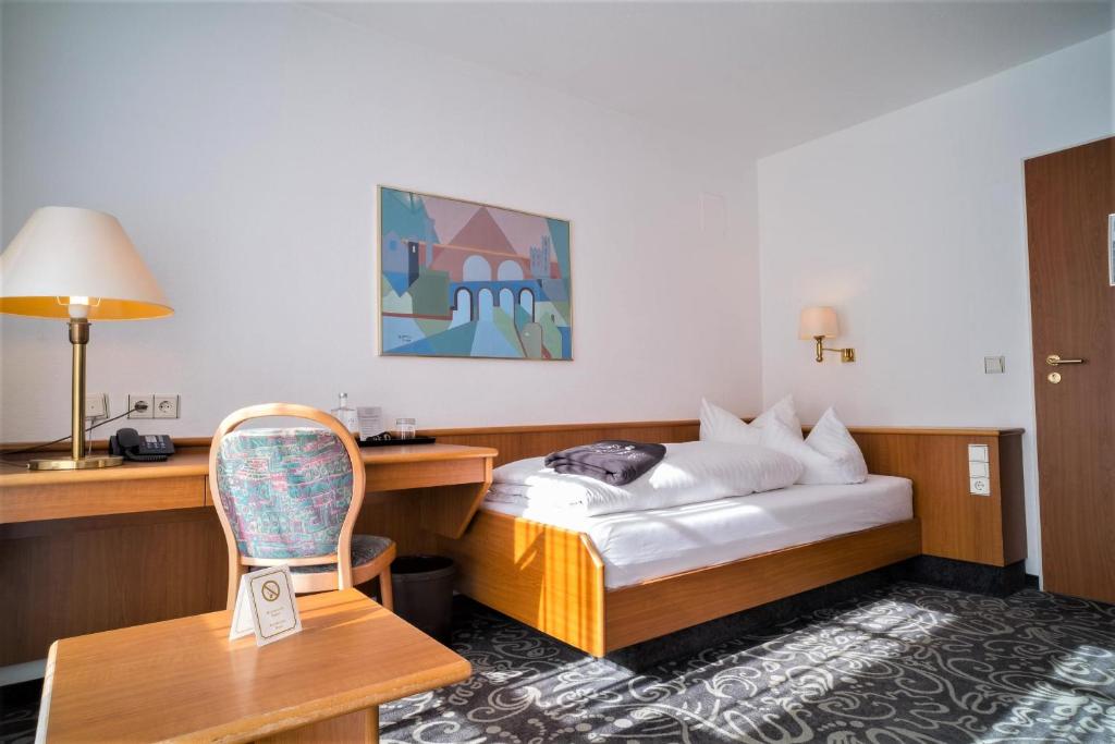 Postel nebo postele na pokoji v ubytování ALFA Hotel - Superior