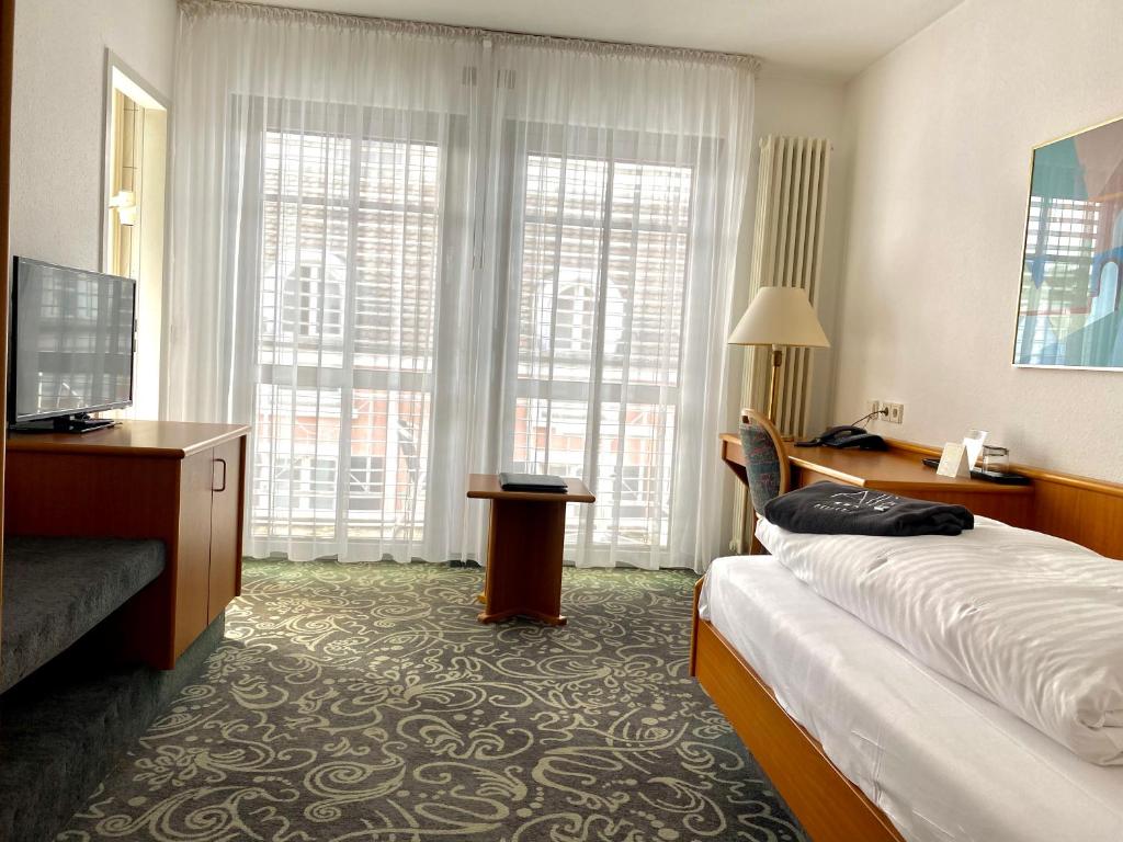 Postel nebo postele na pokoji v ubytování ALFA Hotel - Superior